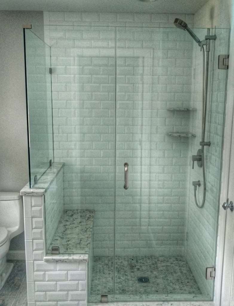 custom shower enclosure with white brick tile