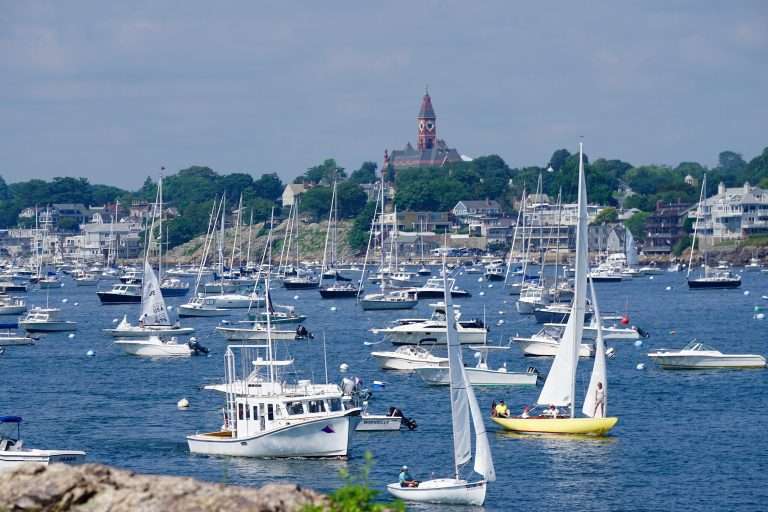 Boats anchored in a scenic coastal harbor