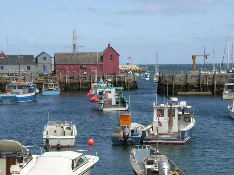 Fishing boats docked at a coastal harbor