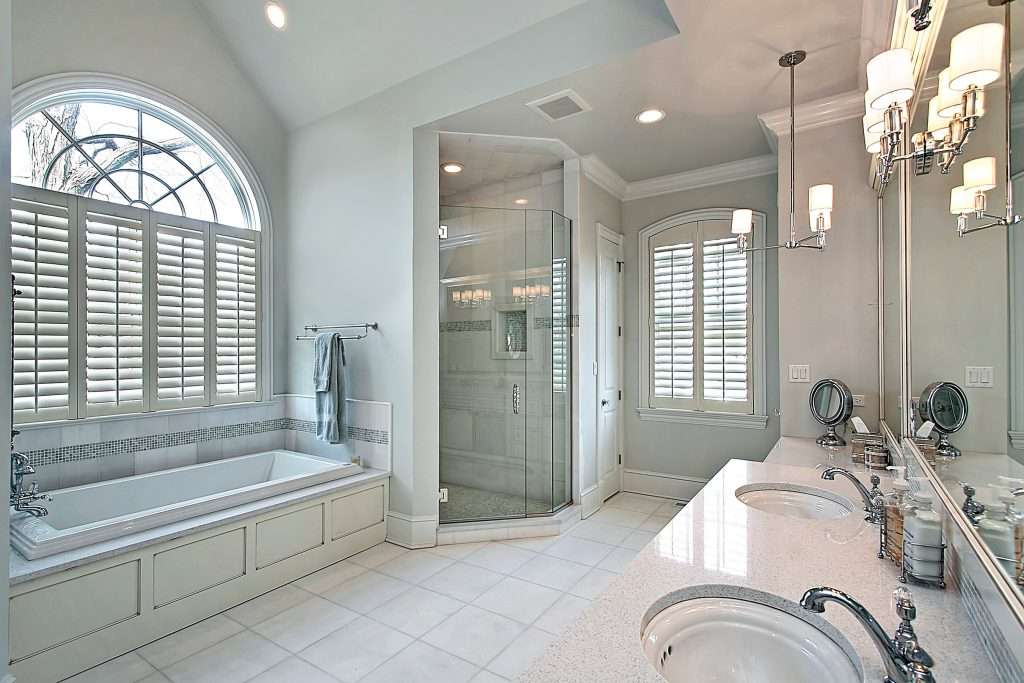 Modern bathroom with bathtub and glass shower enclosure