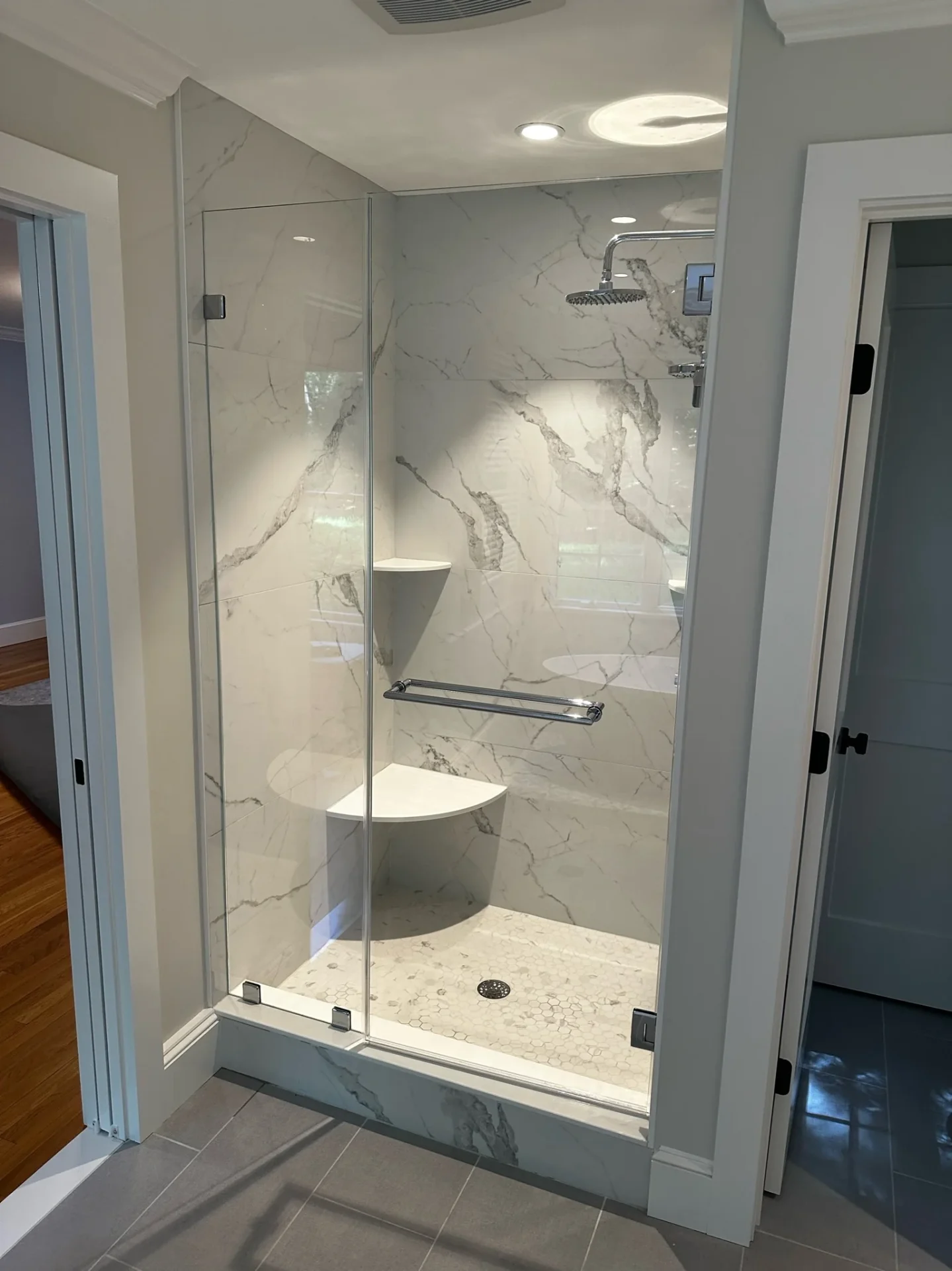 Frameless hinged shower door chrome calacatta porcelain slab Boxford MA