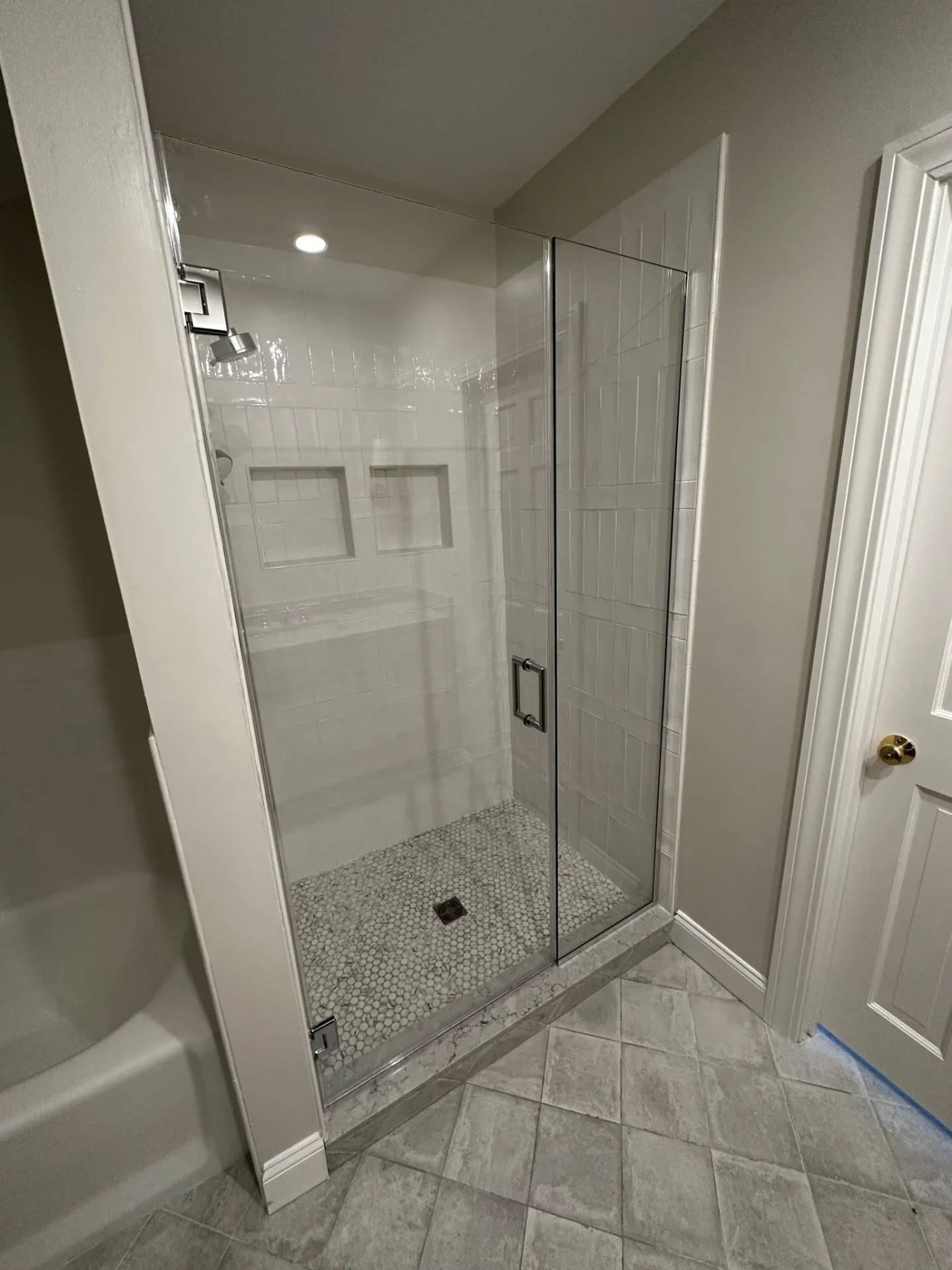 frameless pivot shower door chrome white subway tile penny floor Marblehead MA