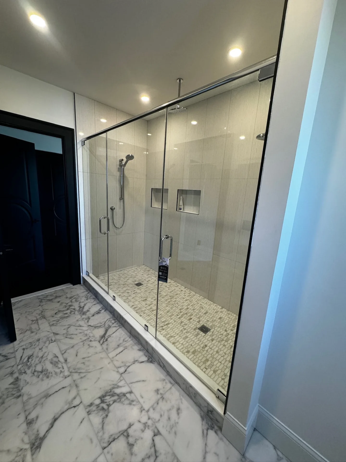 frameless sliding shower door chrome hardware mosaic tile floor Danvers MA