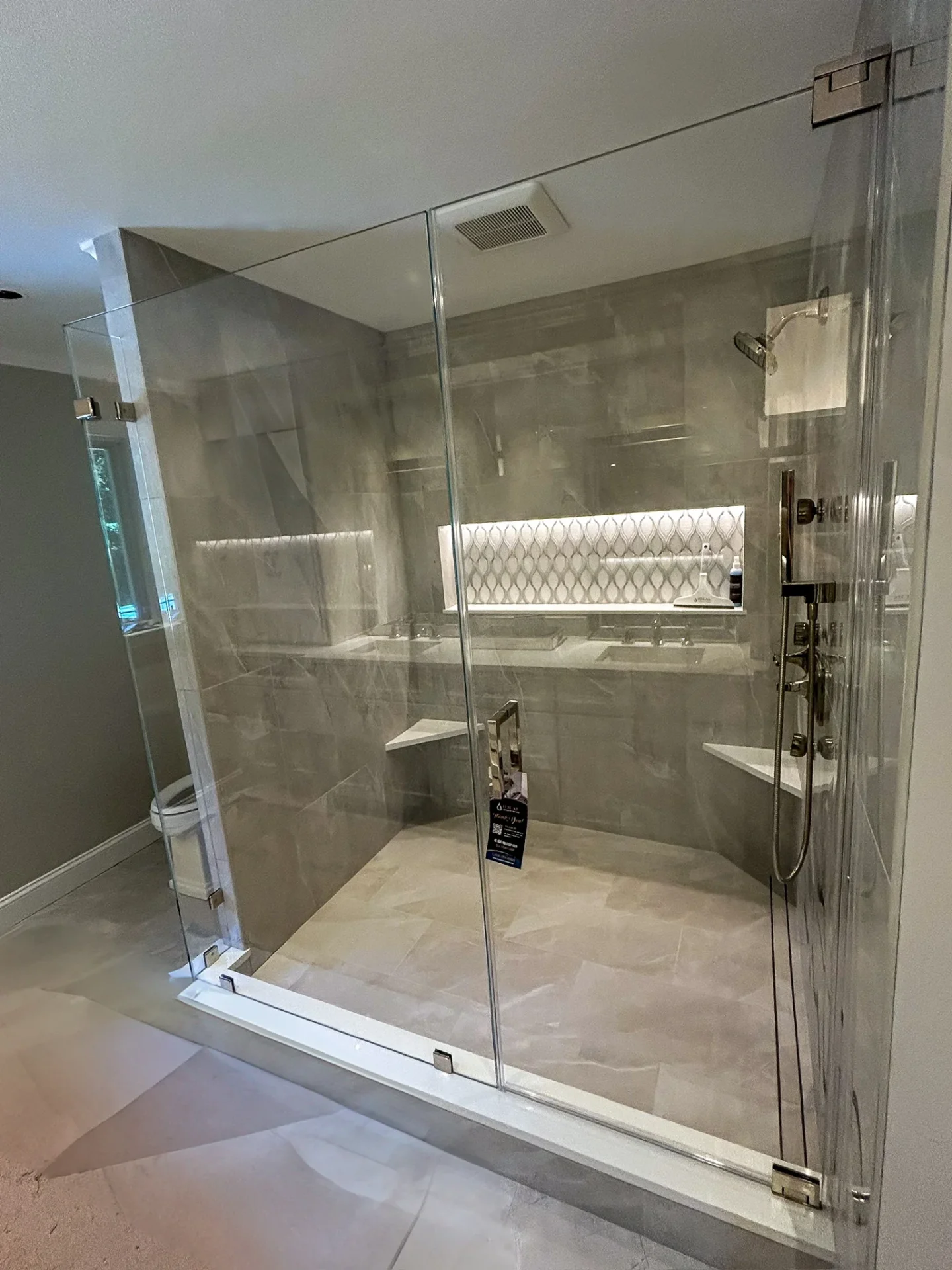 frameless walk-in shower enclosure polished chrome large format gray tile Newburyport MA