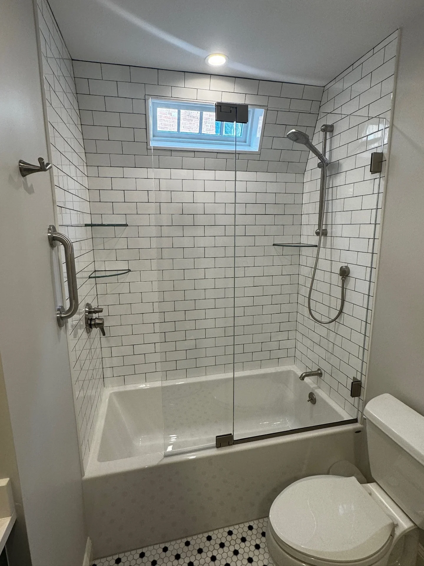 frameless tub door brushed nickel white subway tile black hex floor Salem MA