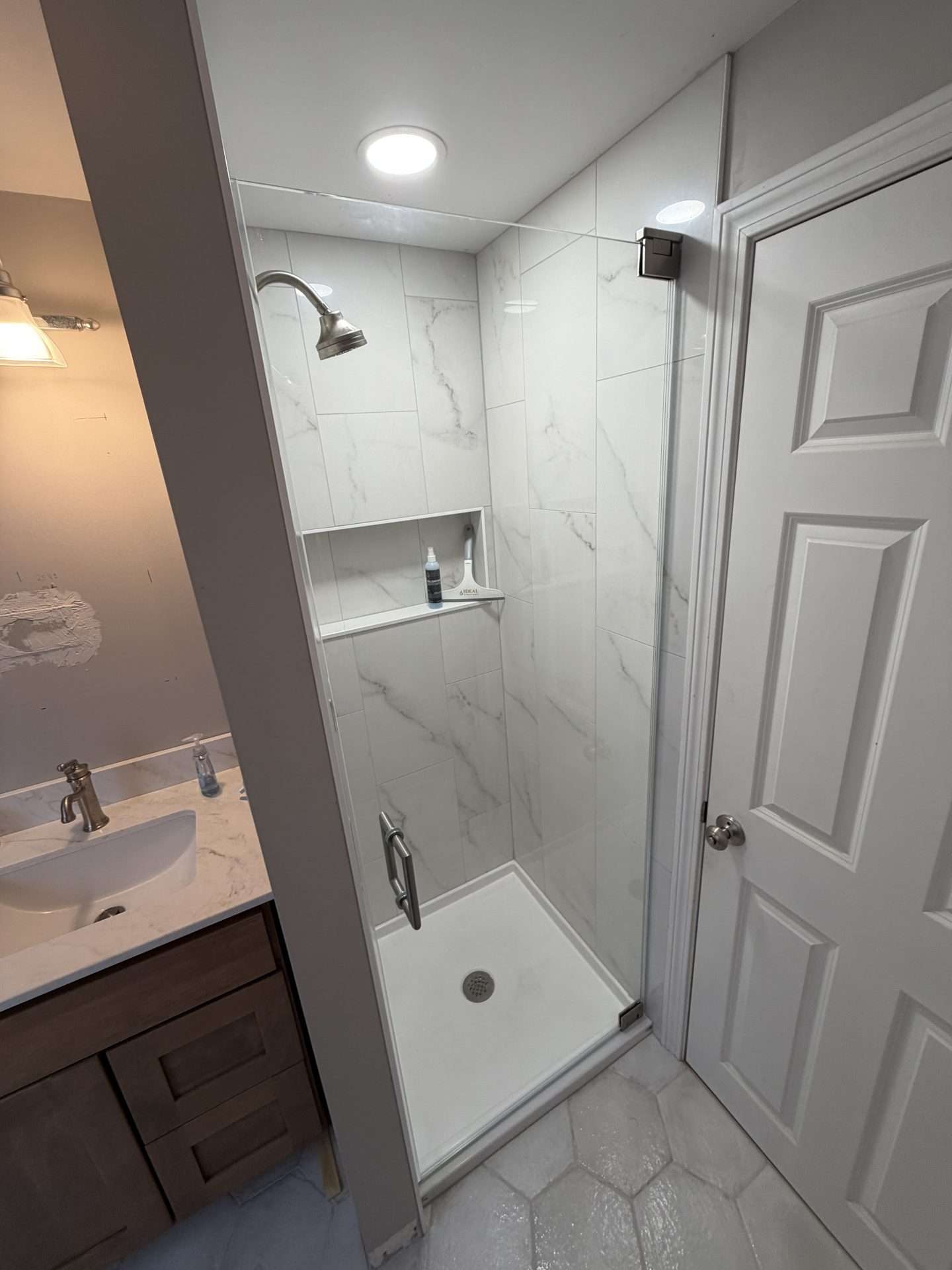 Frameless glass shower door installation in North Shore, MA