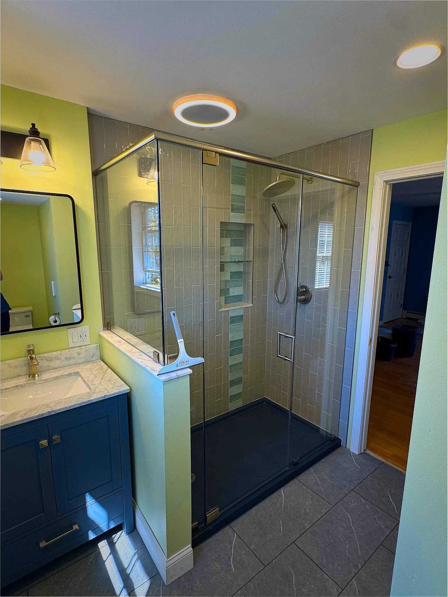Semi-frameless corner shower chrome header gray subway tile Manchester NH