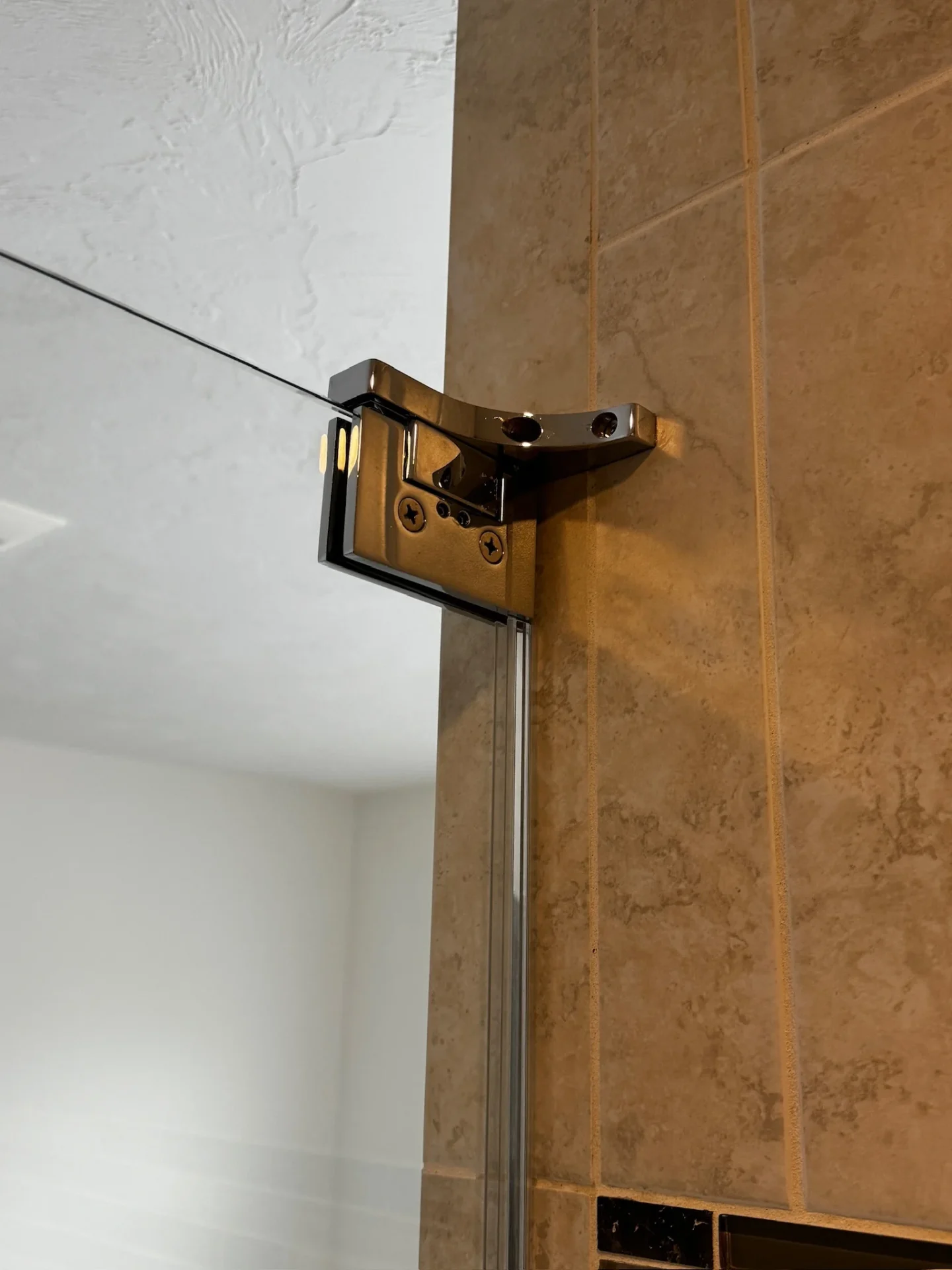 Chrome wall hinge frameless shower door travertine tile Littleton MA