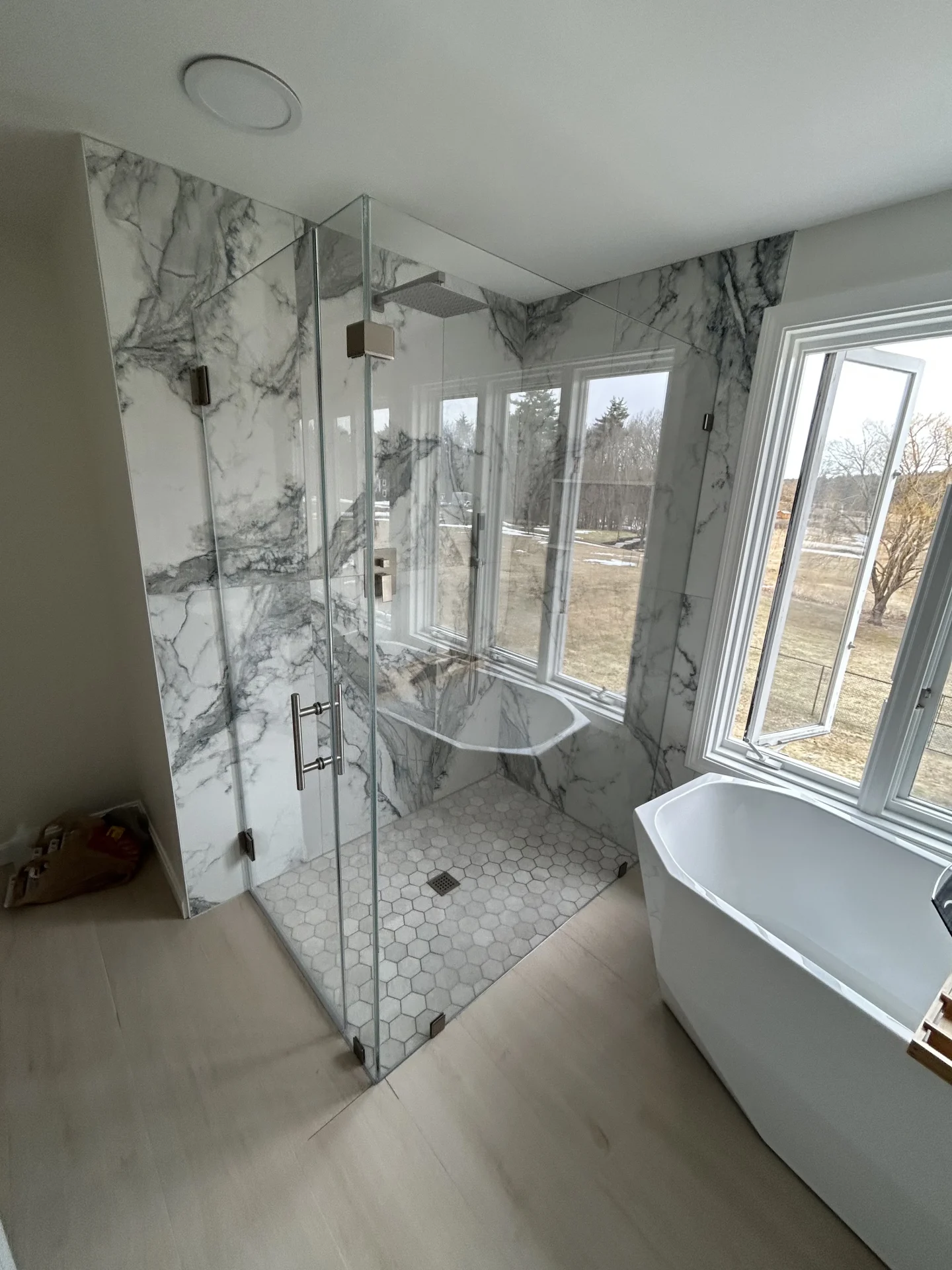 Frameless corner enclosure brushed nickel marble slab hex tile Milford NH