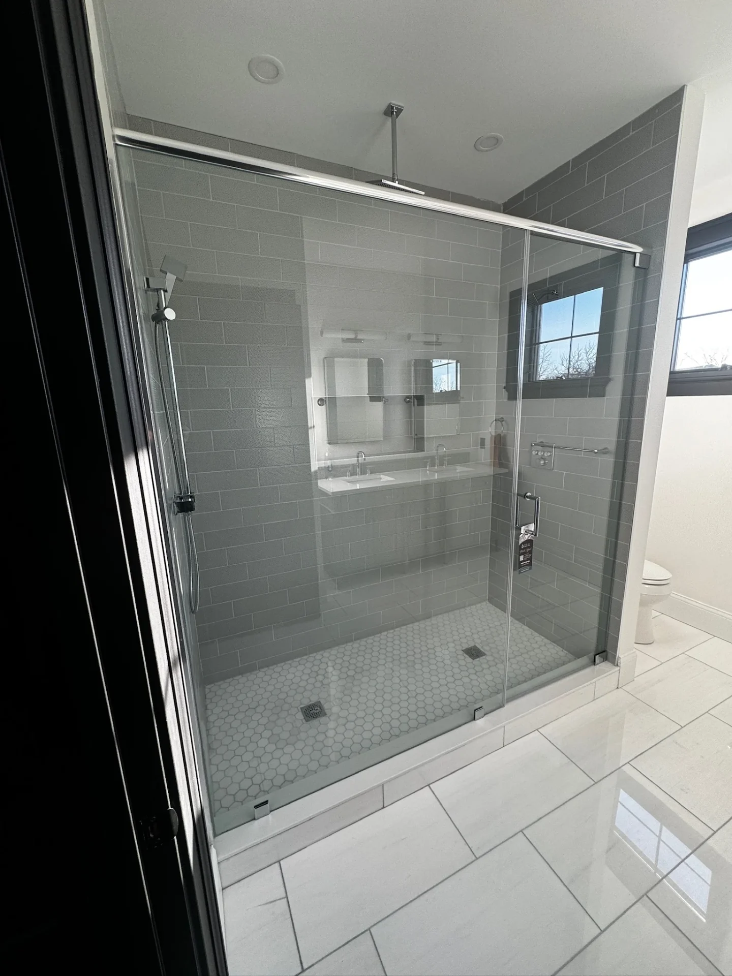Frameless sliding bypass shower door chrome ceiling track gray tile Danvers MA