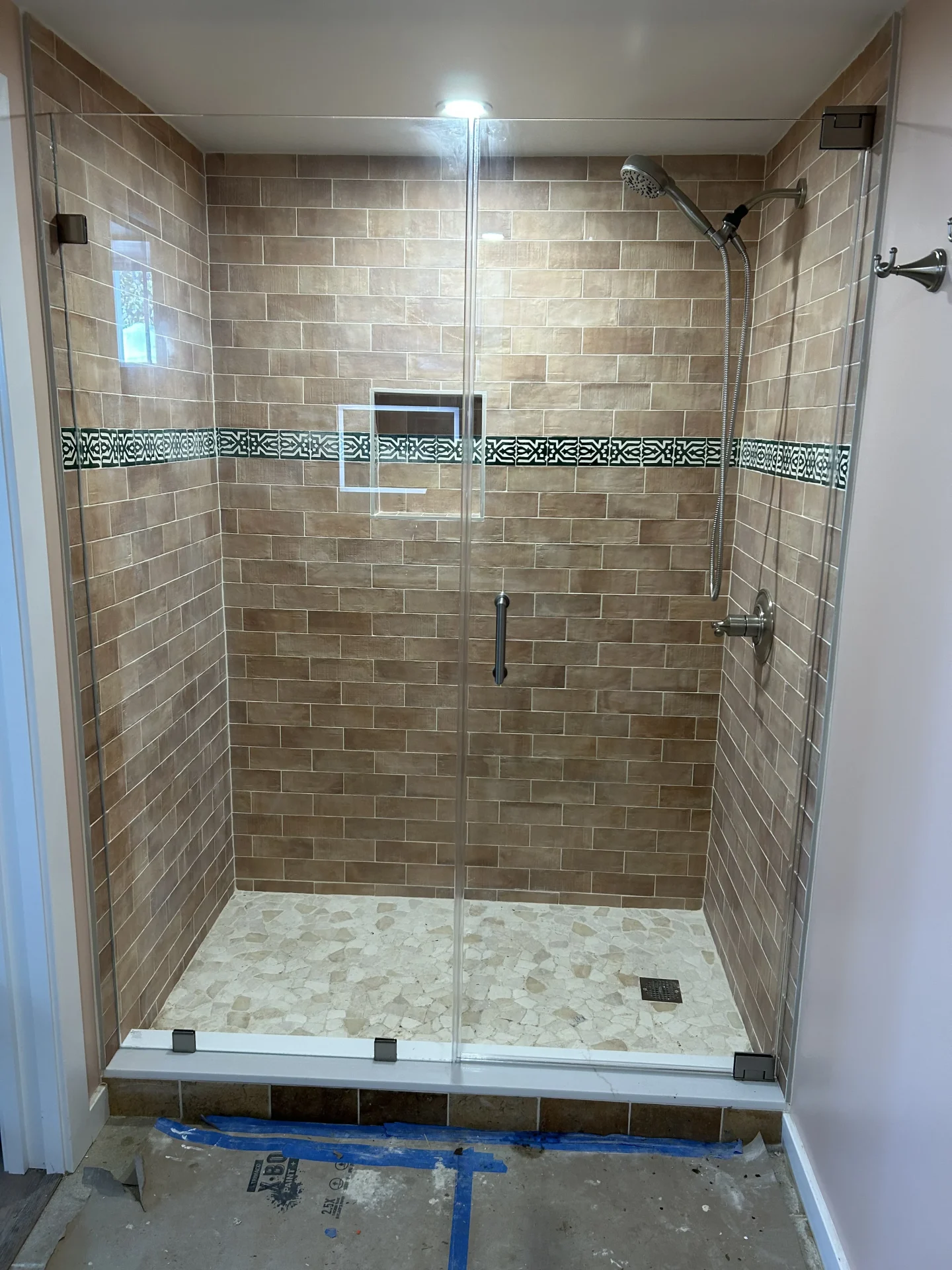 Frameless hinged door oil-rubbed bronze hardware terracotta subway tile Salem MA