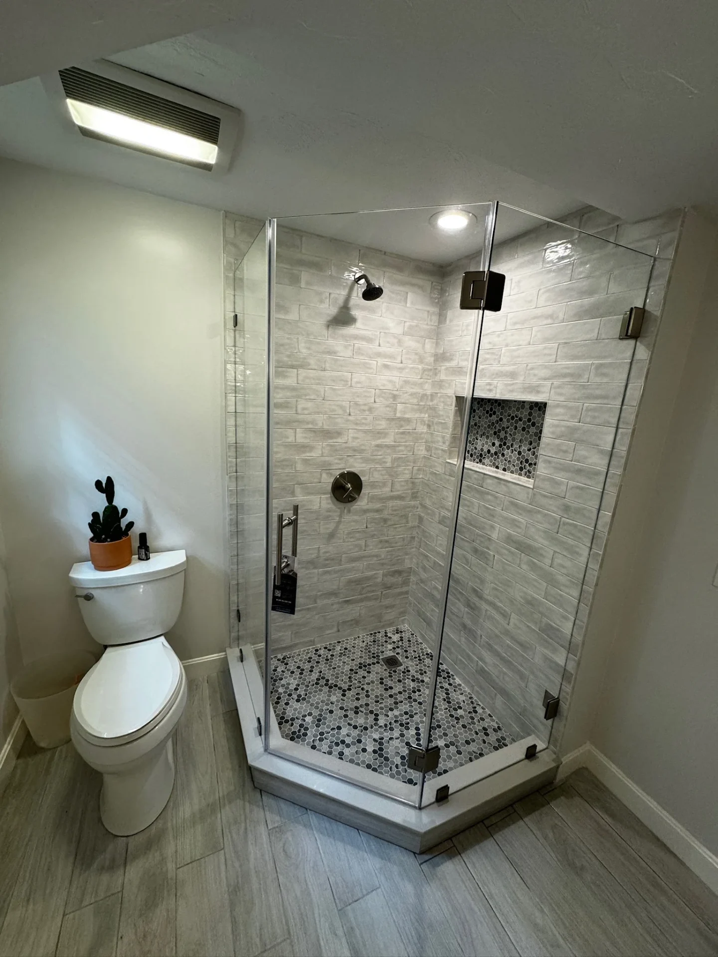 Neo-angle frameless enclosure oil-rubbed bronze hardware hex tile Mansfield MA