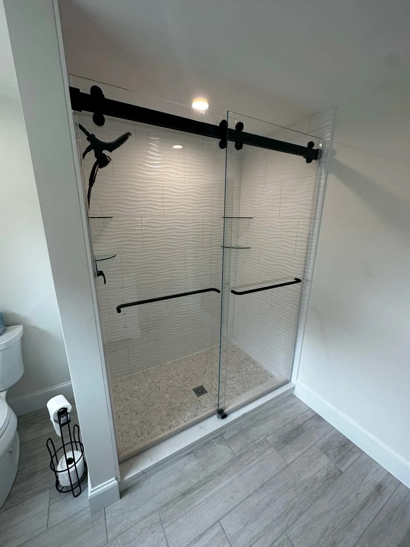 Sliding barn door frameless shower matte black track wave tile Danvers MA