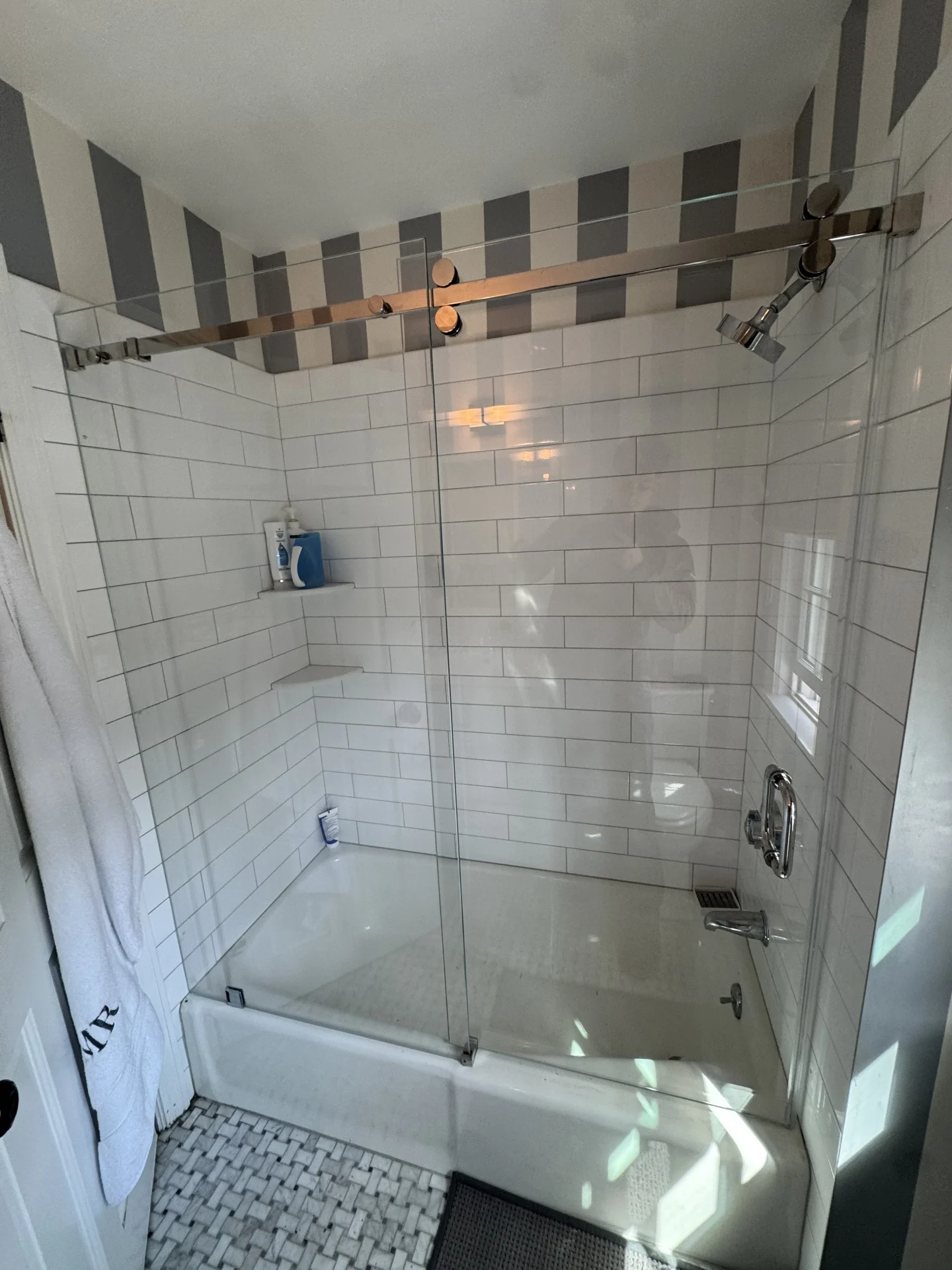 Frameless sliding tub enclosure polished chrome roller track subway tile Wellesley MA