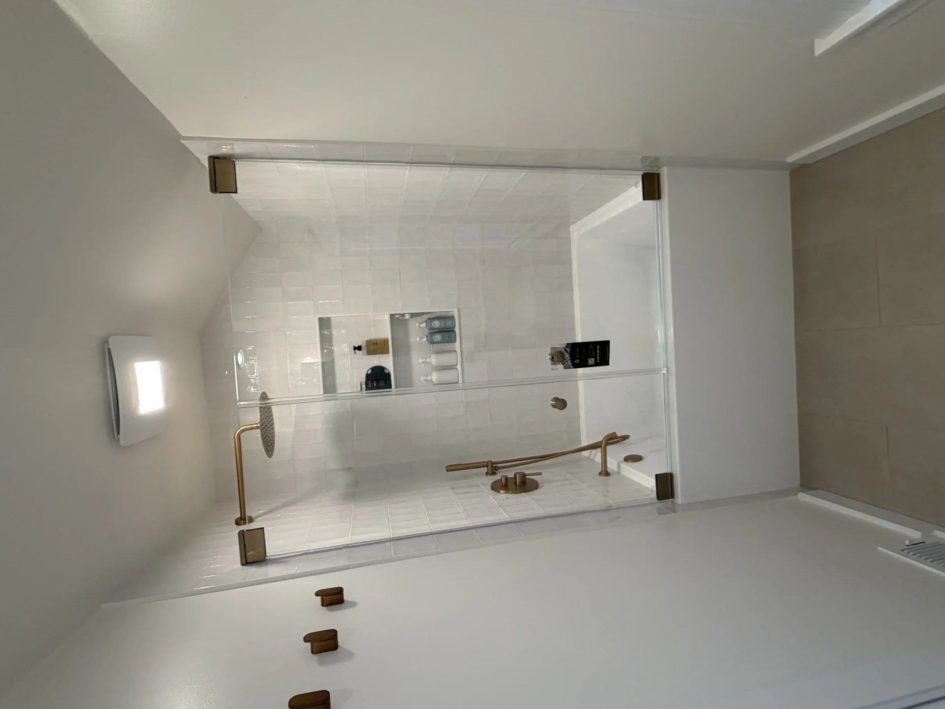 Frameless fixed glass panel brushed brass clips white square tile Newton MA