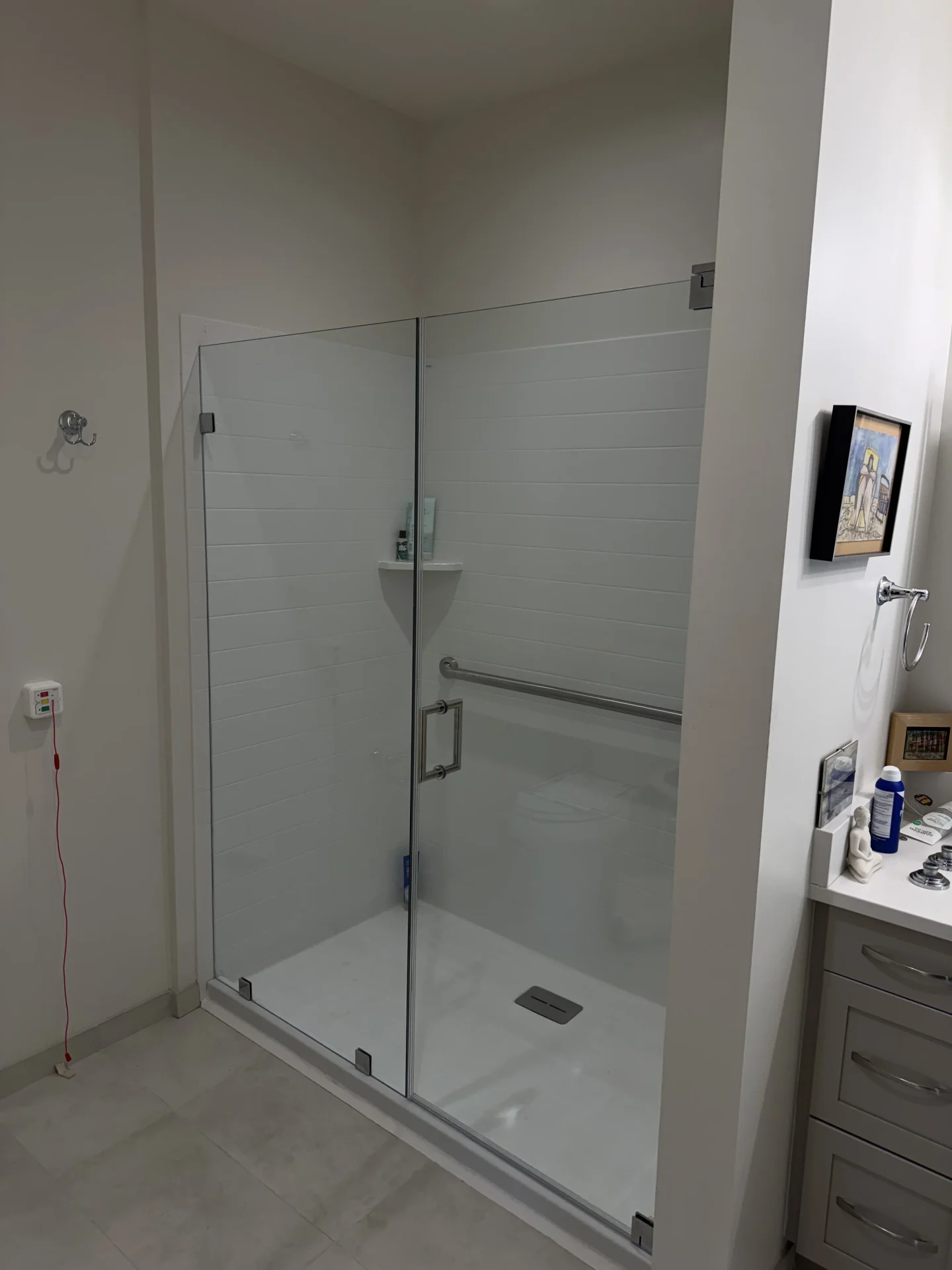 Frameless hinged door chrome wall clips horizontal white tile Newton MA