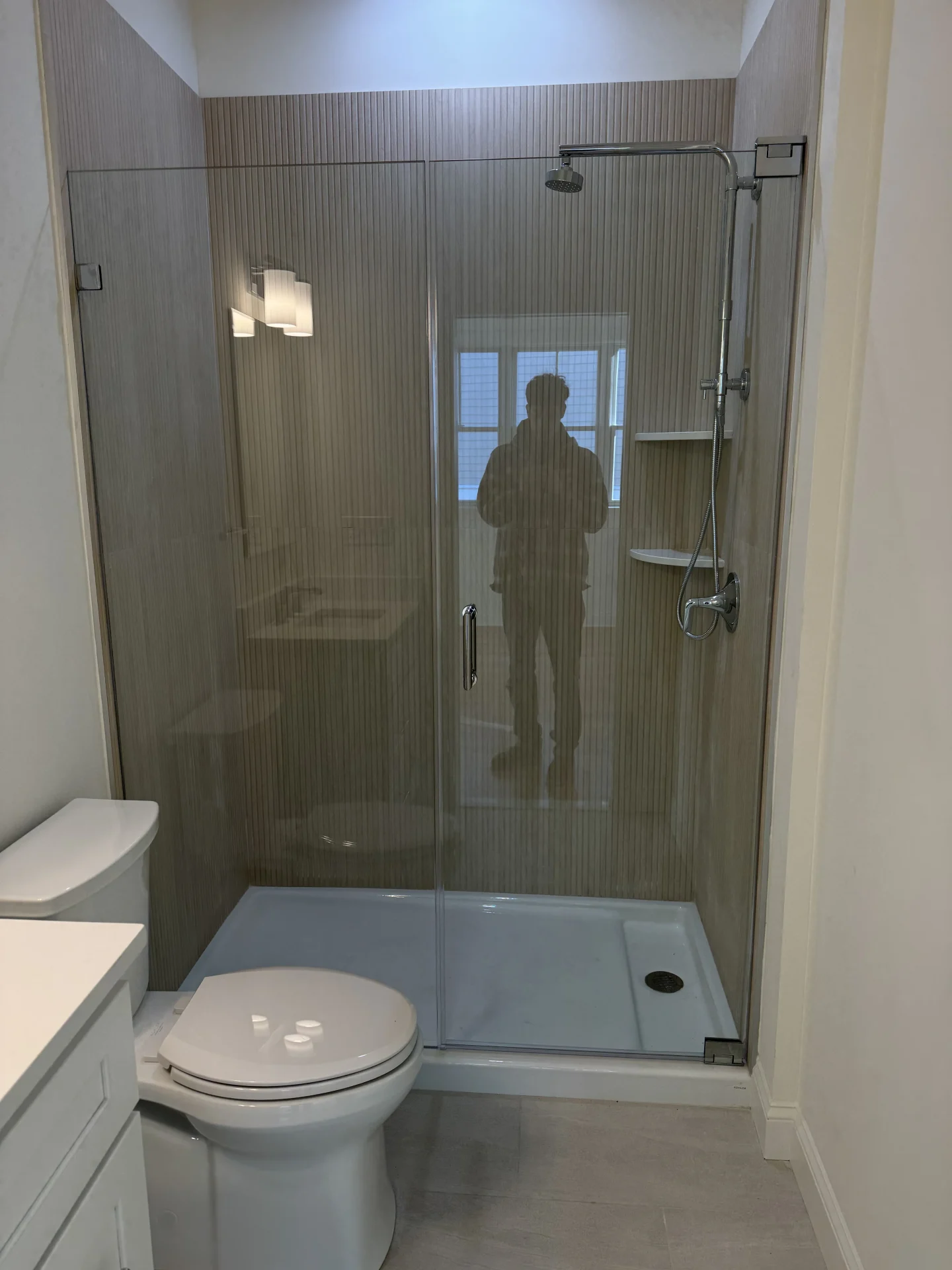 Frameless hinged door chrome hardware ribbed porcelain tile Reading MA