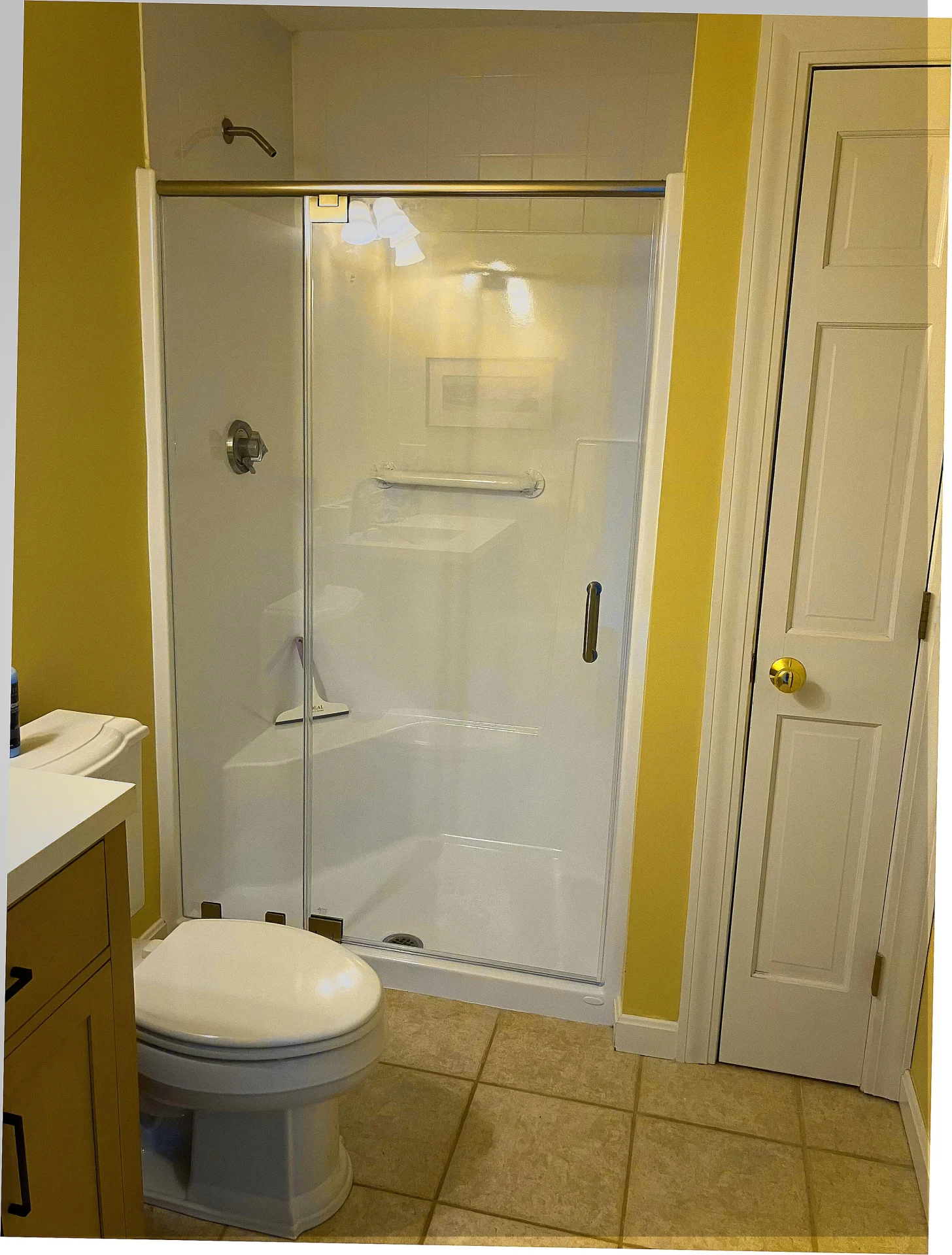 Semi-frameless sliding door chrome hardware white alcove shower Exeter NH