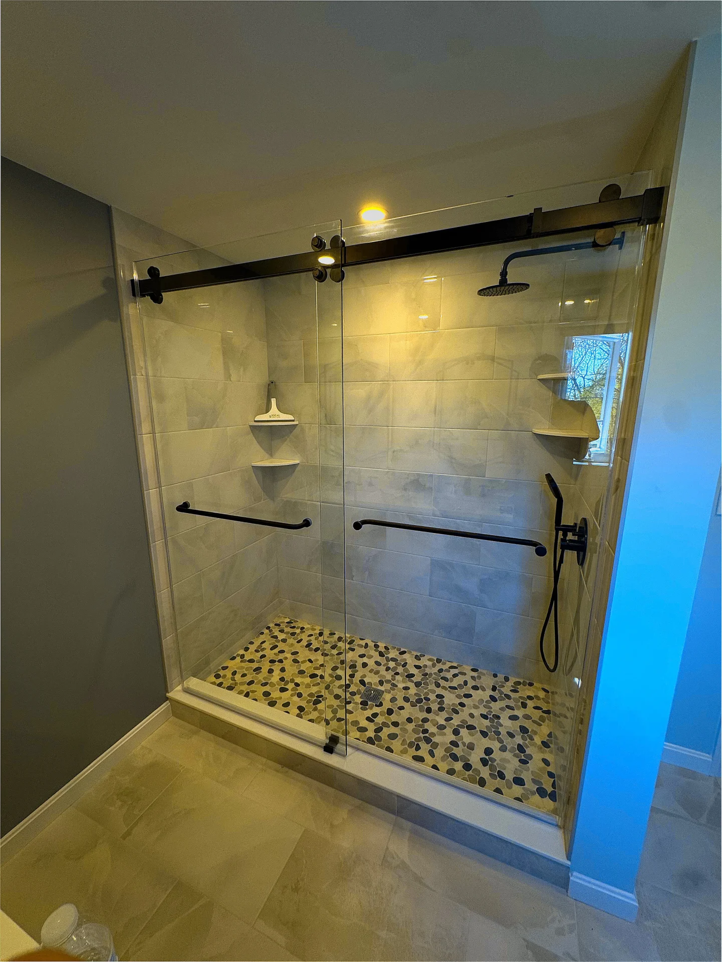 Sliding bypass shower door matte black marble-look tile Beverly MA