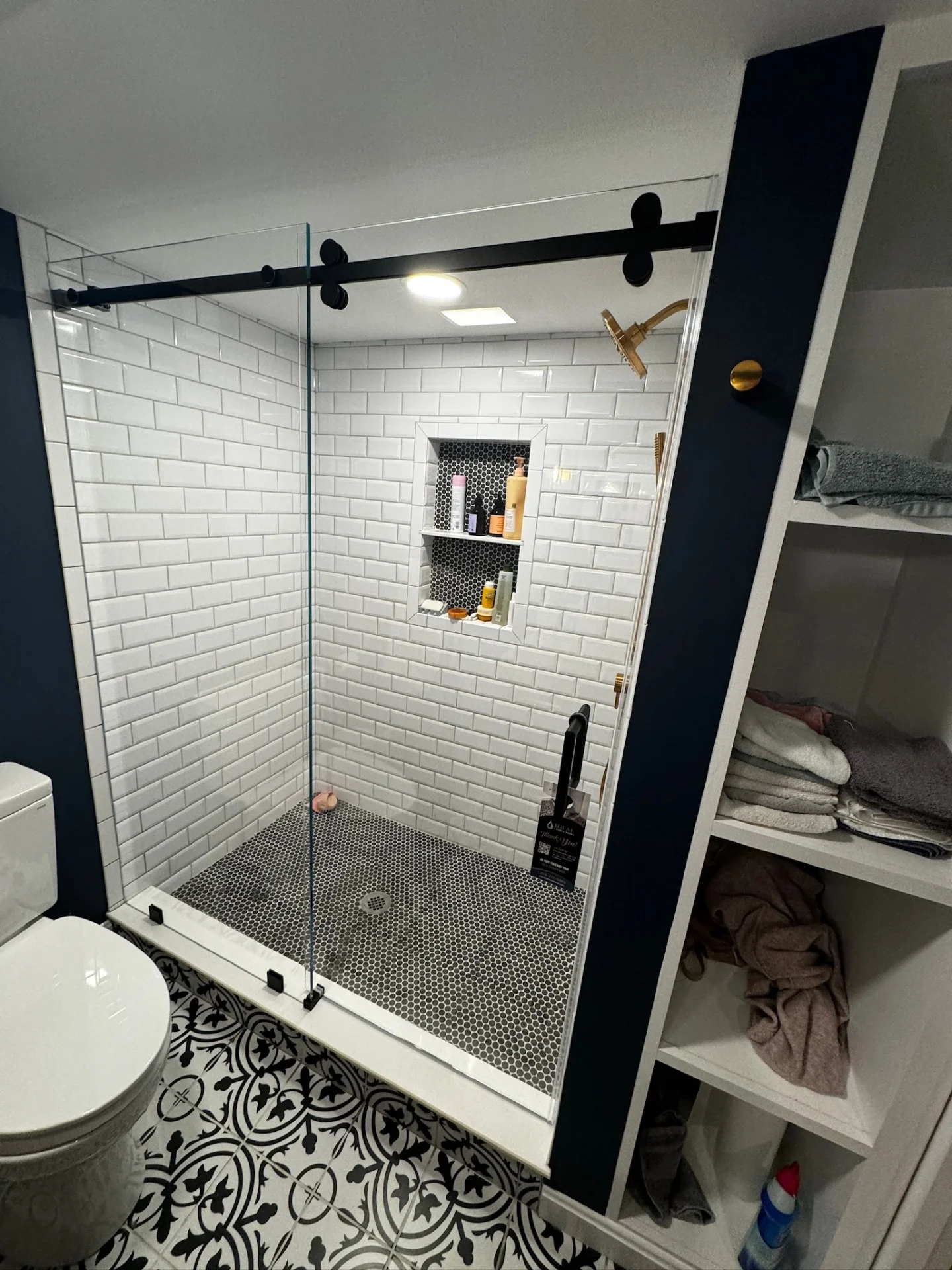 Sliding barn door matte black subway tile penny tile floor Melrose MA