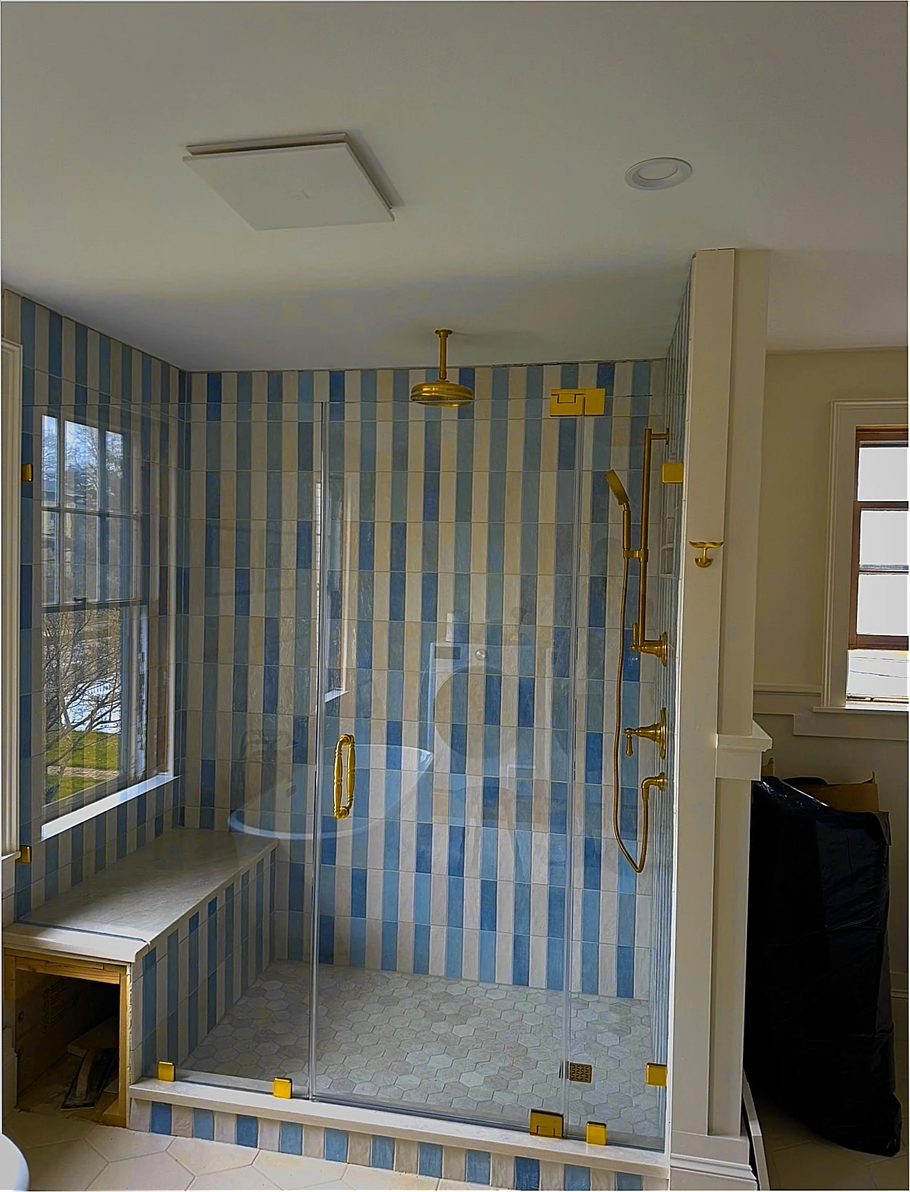 frameless corner shower unlacquered brass blue vertical stripe tile Rockport MA
