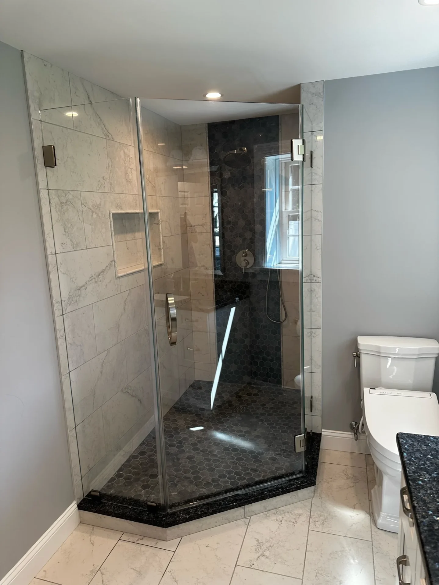 Frameless neo-angle shower enclosure, chrome hardware, hexagon tile, North Andover MA
