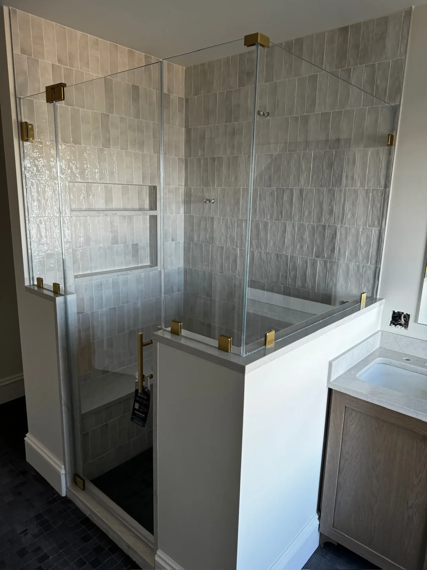 Frameless multi-panel satin brass enclosure stacked subway tile Beverly MA