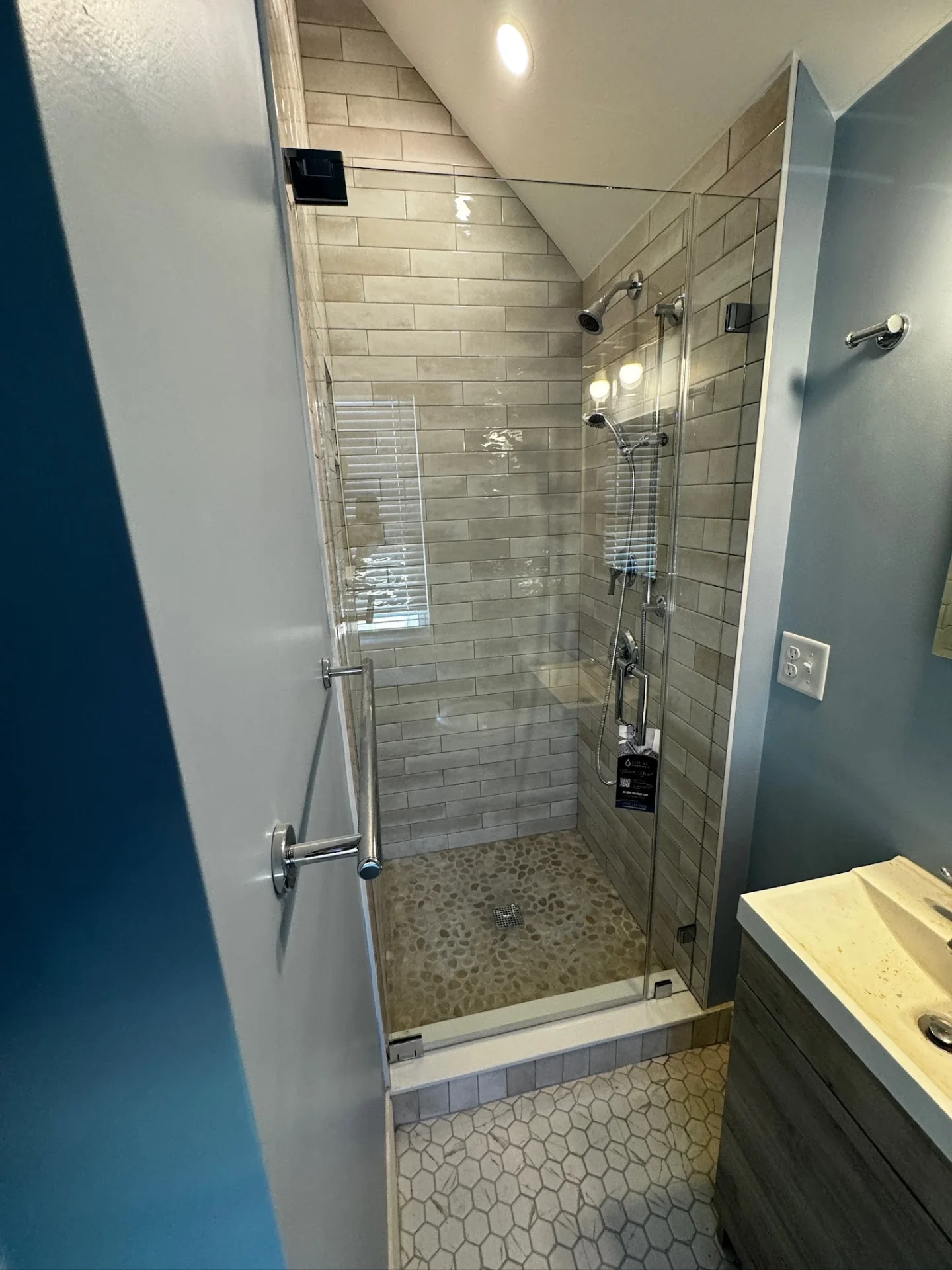 Frameless neo-angle door, chrome hardware, stacked subway tile, Boston MA