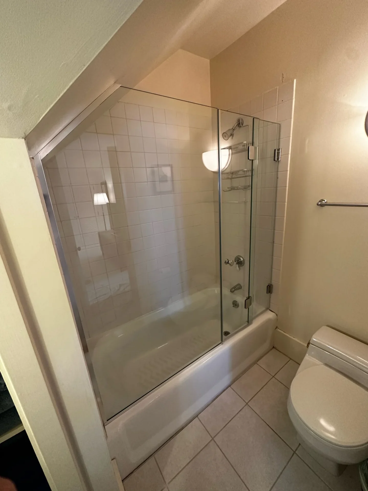 Frameless tub splash panel with chrome hardware and white tile, Manchester-by-the-Sea