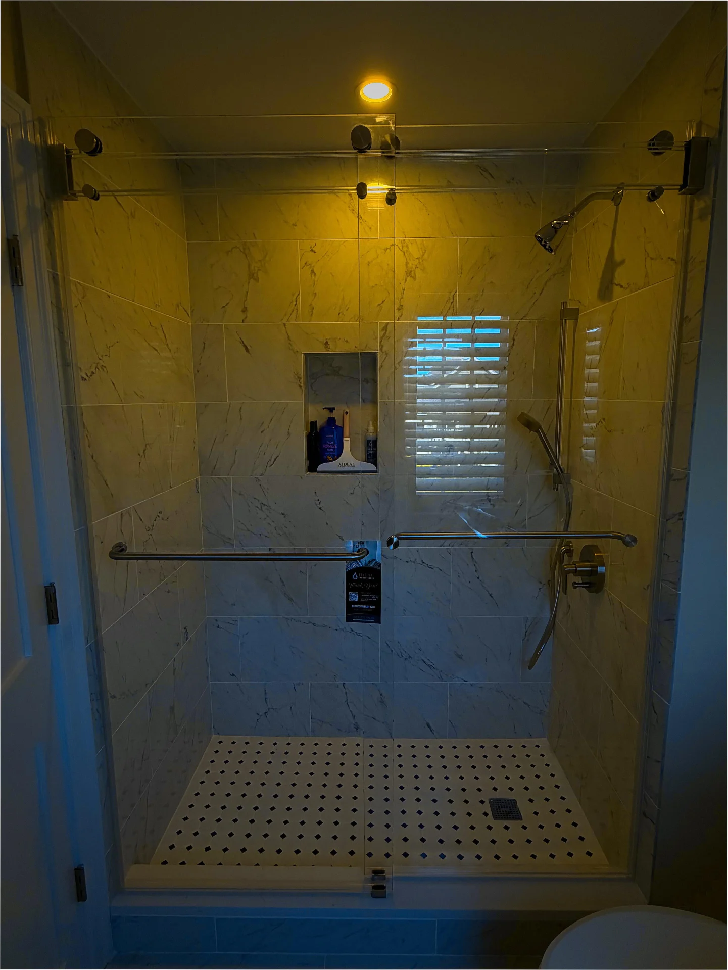 Frameless sliding shower door, brushed nickel track, marble subway tile, Ipswich MA